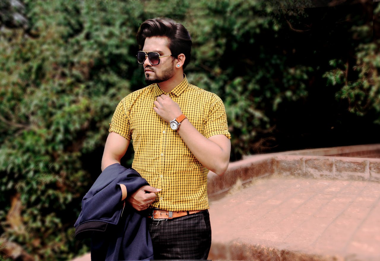 services-bg Stylish man wearing sunglasses and checkered shirt posing outdoors in Mahabaleshwar.
